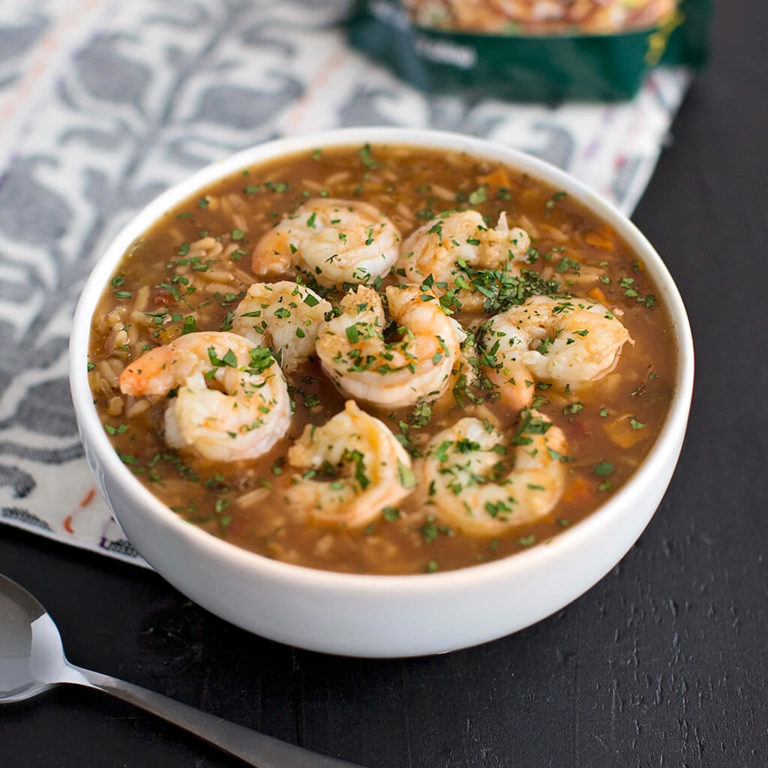 A bowl of savory shrimp gumbo garnished with parsley, a classic Cajun dish, ready to enjoy.